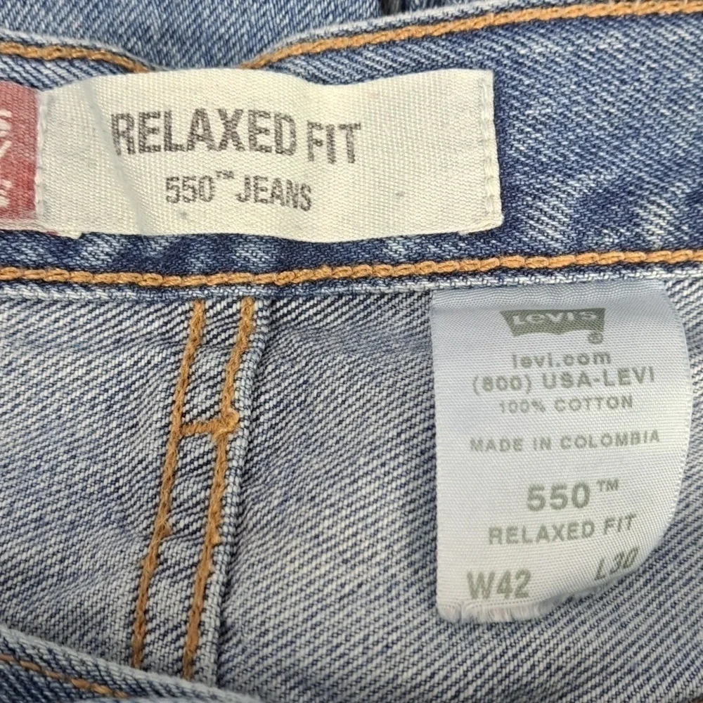 Levi's 550 relaxed fit med light wash straight leg baggy legs denim jeans 42/30